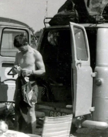man with van preparing motorcycle for racing